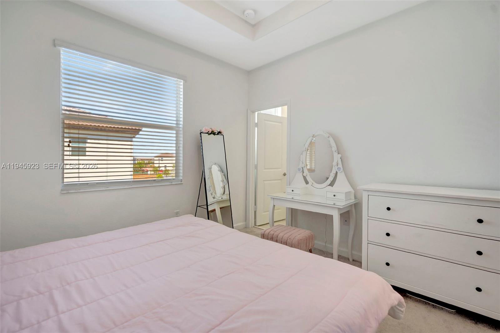 2455 Northwest 119th Street Miami, FL 33167 - Photo 23 of 38 a bedroom with a bed and a dresser