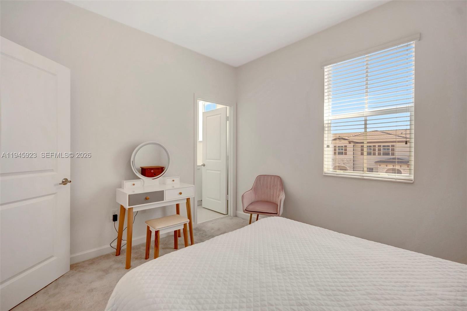 2455 Northwest 119th Street Miami, FL 33167 - Photo 29 of 38 a bedroom with a bed and a window