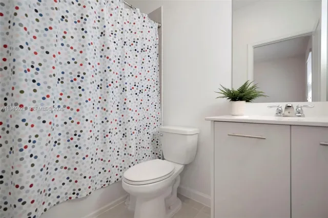 a bathroom with a toilet and a sink
