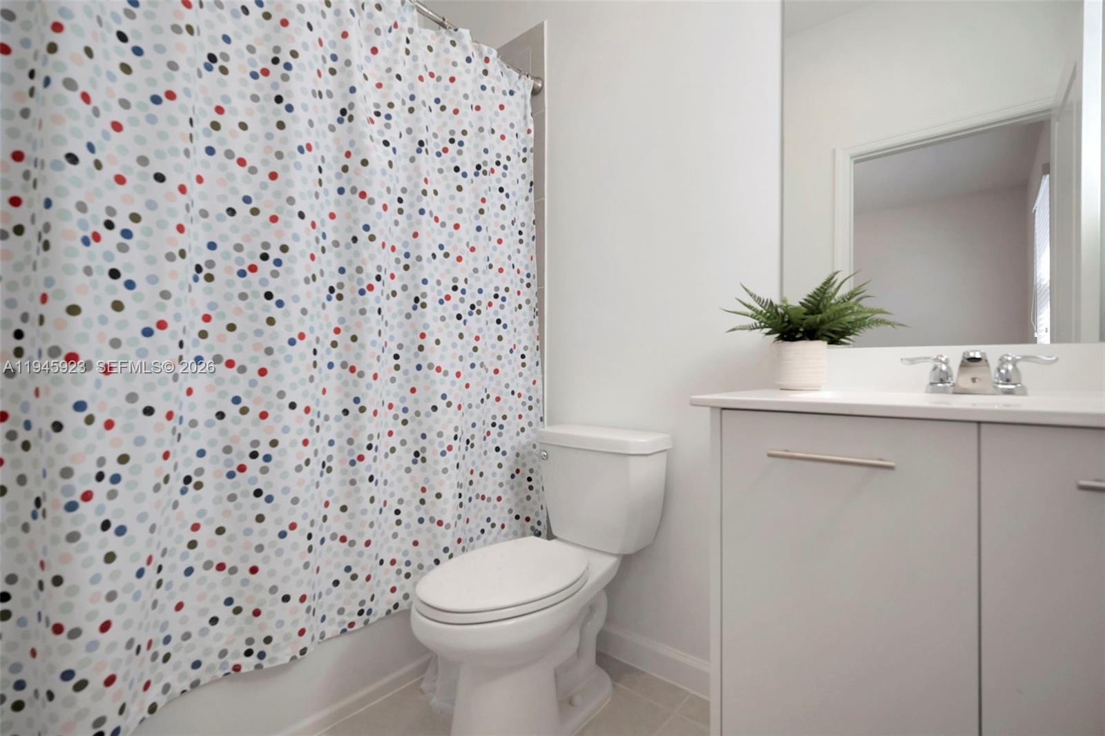 2455 Northwest 119th Street Miami, FL 33167 - Photo 32 of 38 a bathroom with a toilet and a sink