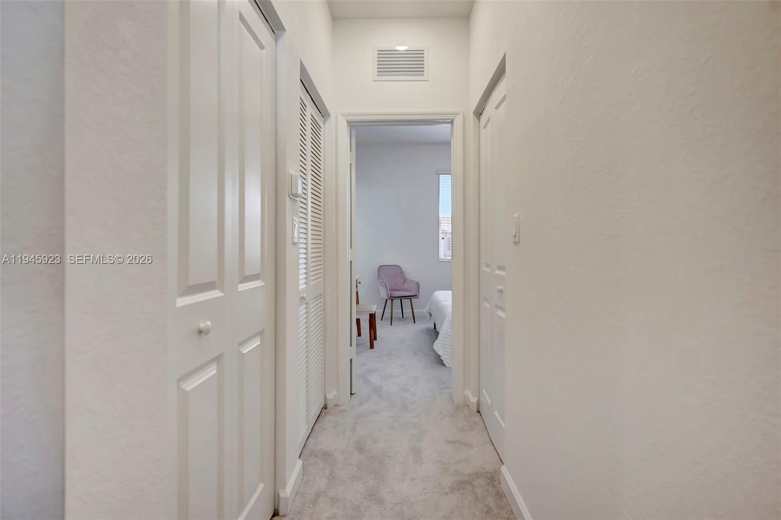 2455 Northwest 119th Street Miami, FL 33167 - Photo 33 of 38 a view of a livingroom from a hallway