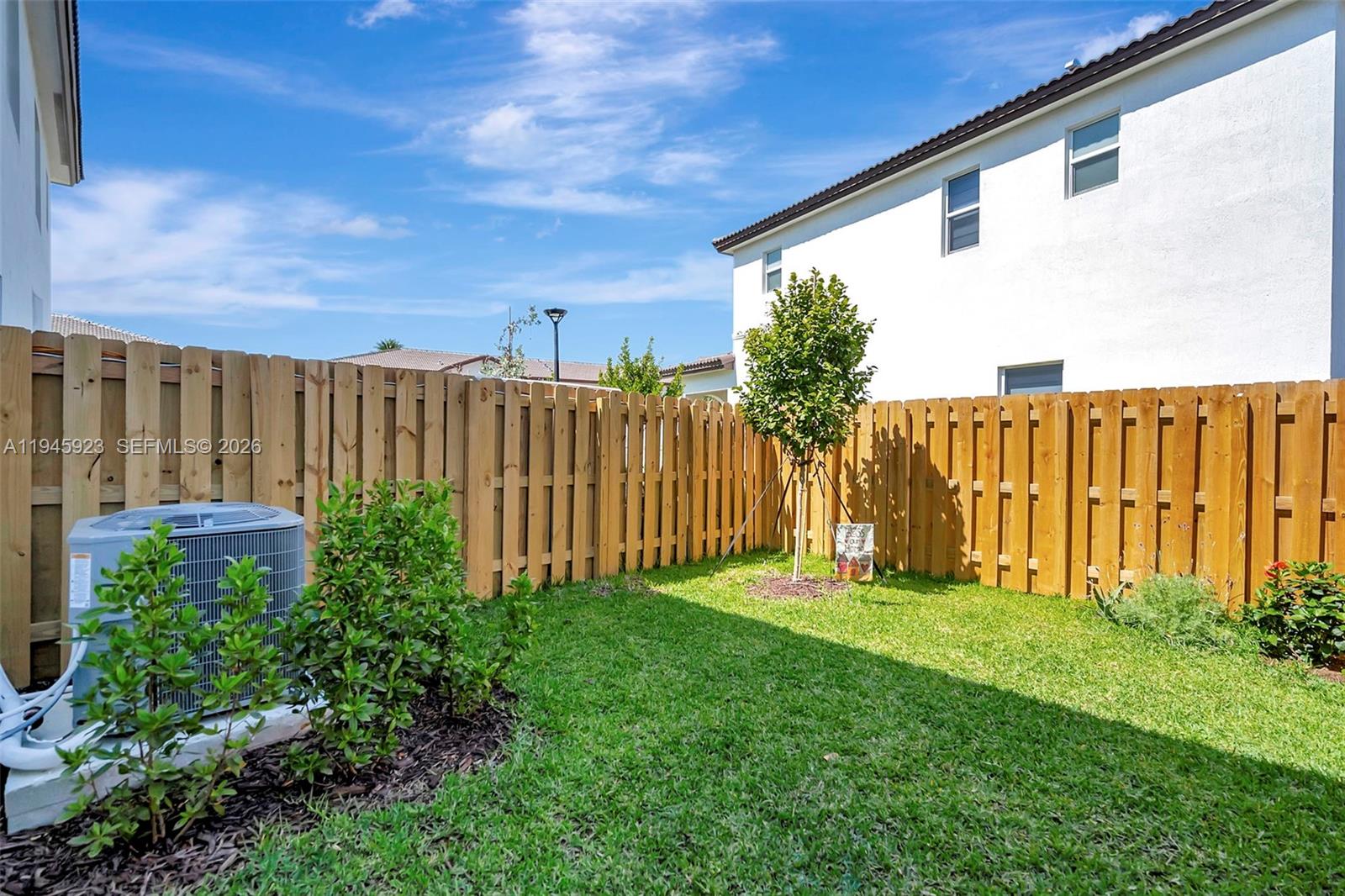 2455 Northwest 119th Street Miami, FL 33167 - Photo 36 of 38 a view of a backyard with potted plants