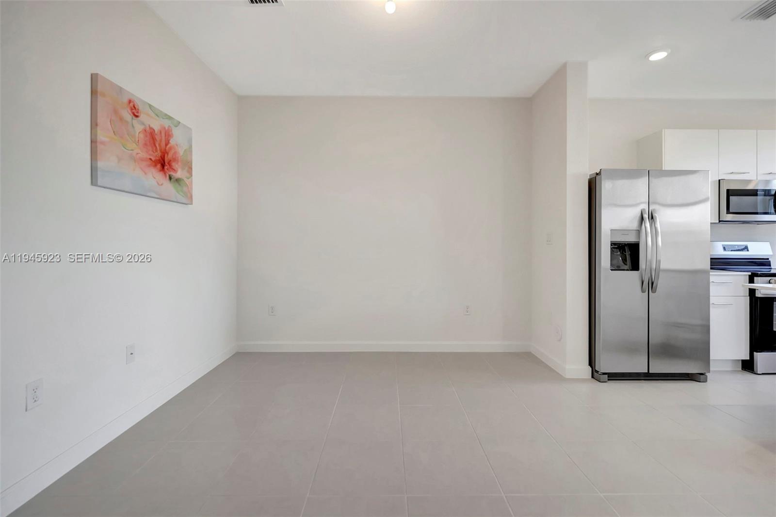 2455 Northwest 119th Street Miami, FL 33167 - Photo 7 of 38 a view of a refrigerator in kitchen