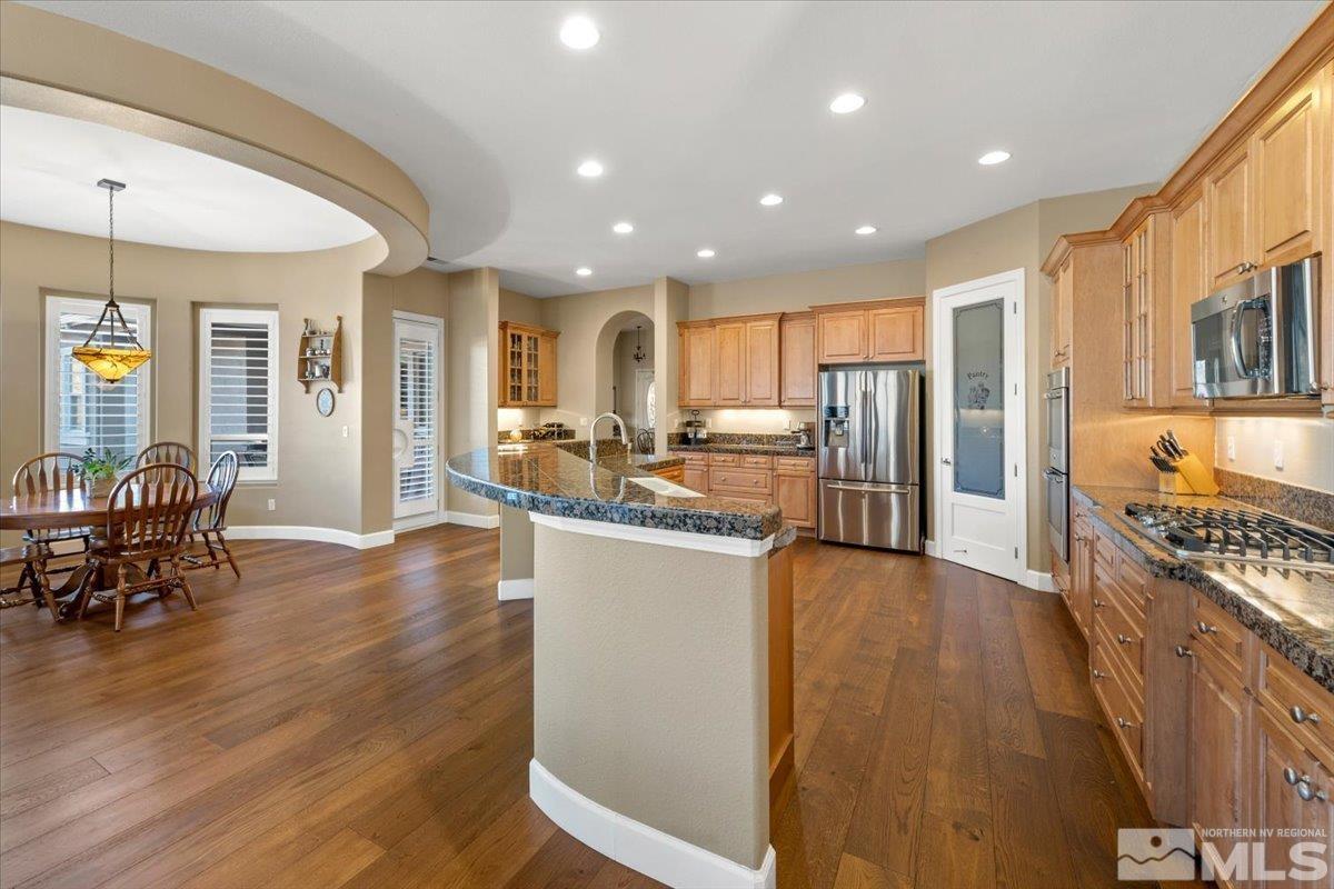 15185 Chateau Avenue Reno, NV 89511 - Photo 13 of 39 a view of kitchen with stainless steel appliances granite countertop a stove and a refrigerator