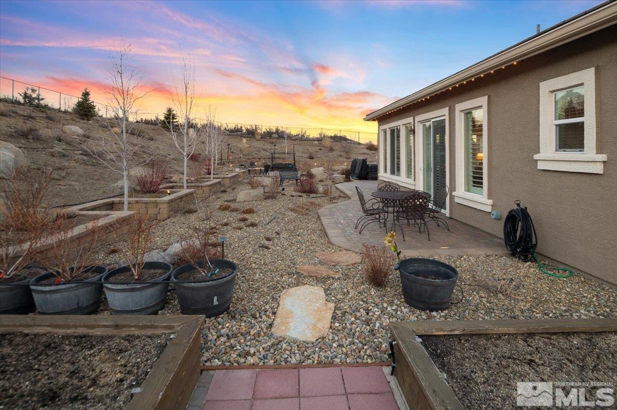 15185 Chateau Avenue Reno, NV 89511 - Photo 27 of 39 a view of a patio with chair and tables