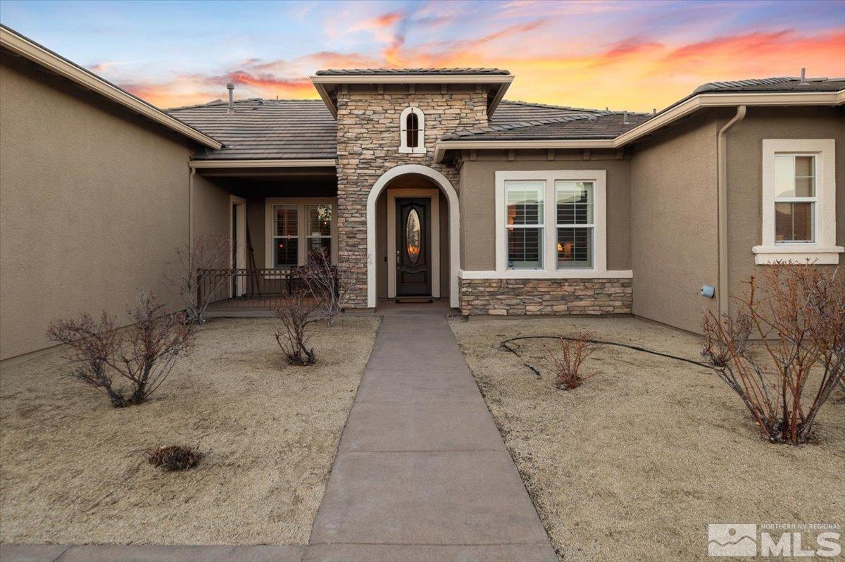 15185 Chateau Avenue Reno, NV 89511 - Photo 6 of 39 a front view of a house with yard