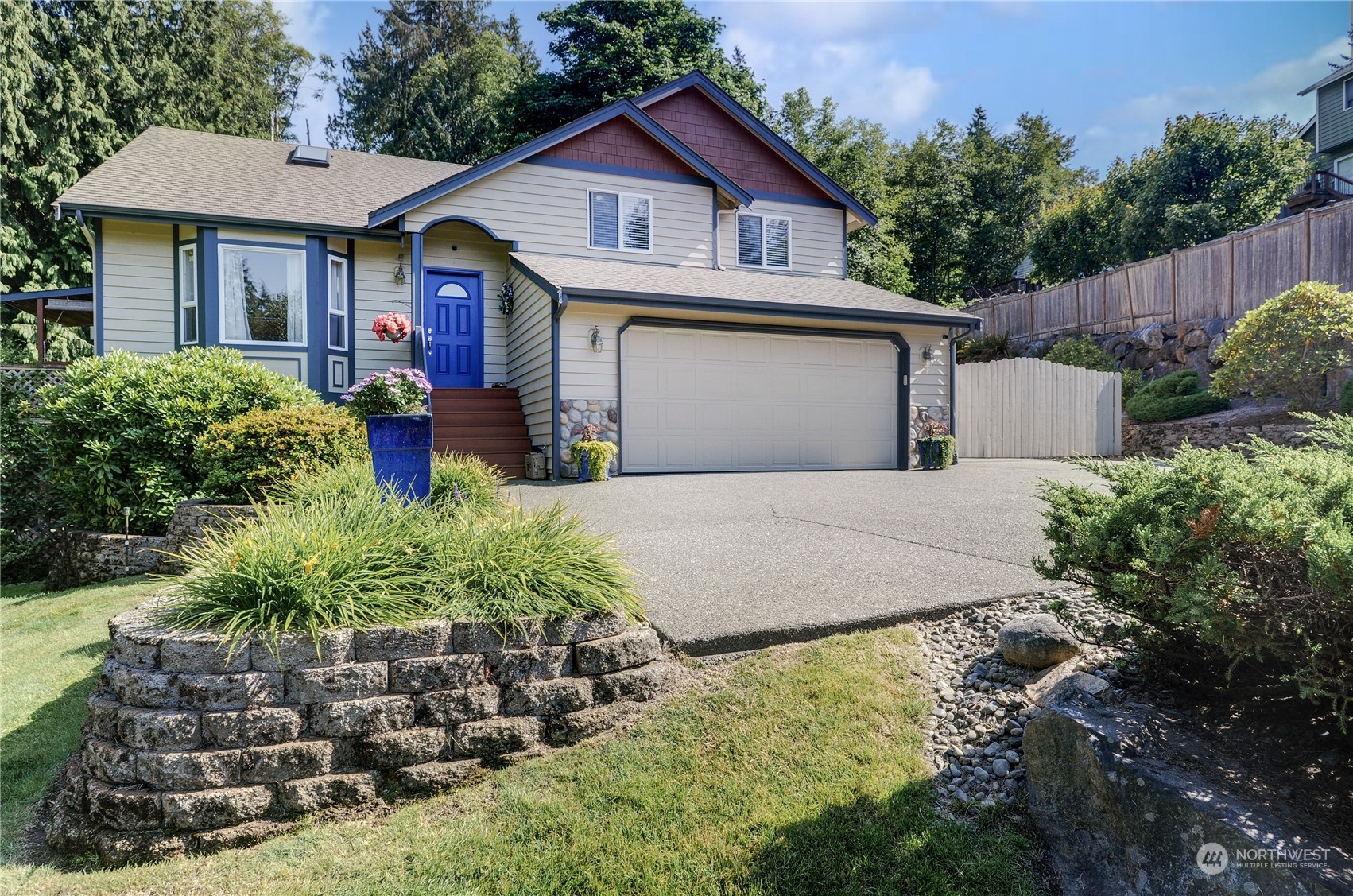 5303 Narbeck Avenue Everett, WA 98203 - Photo 37 of 40 a front view of a house with a yard and garage