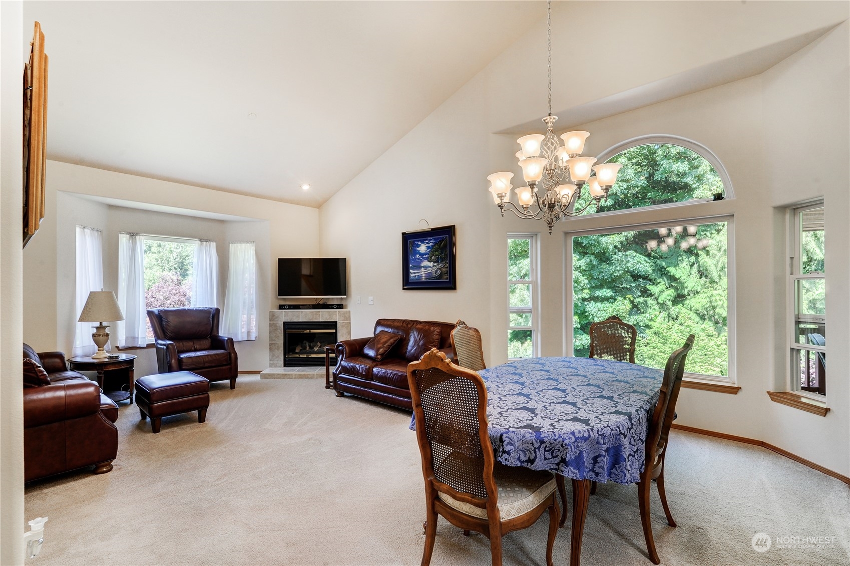 5303 Narbeck Avenue Everett, WA 98203 - Photo 9 of 40 a living room with furniture a flat screen tv and a large window