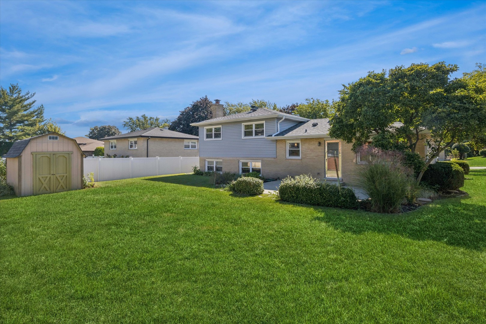 1310 Iroquois Lane Darien, IL 60561 - Photo 20 of 22 a view of a house with backyard and garden