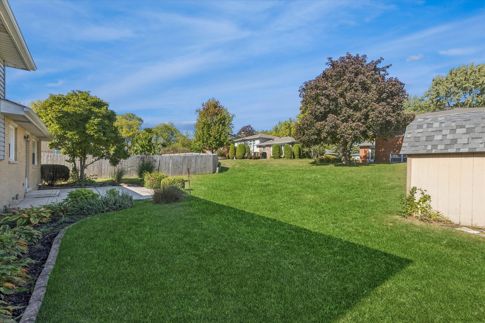 1310 Iroquois Lane Darien, IL 60561 - Photo 22 of 22 a view of a house with a backyard