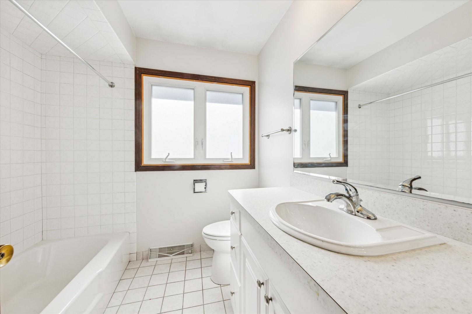 1310 Iroquois Lane Darien, IL 60561 - Photo 10 of 22 a bathroom with a sink toilet and shower