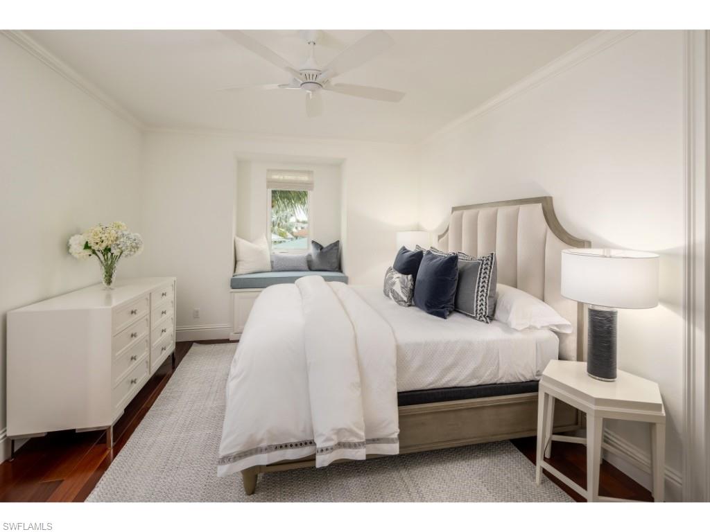 4042 Old Trail Way Naples, FL 34103 - Photo 11 of 20 a spacious bedroom with a bed and a window