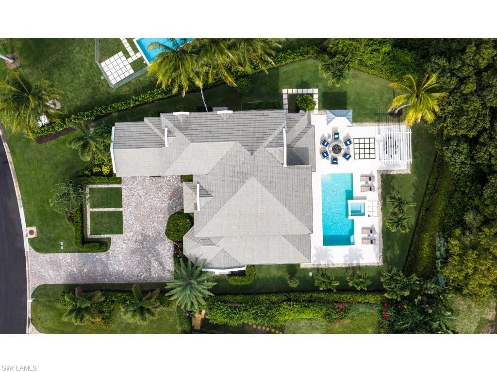 4042 Old Trail Way Naples, FL 34103 - Photo 20 of 20 a view of a house with a yard