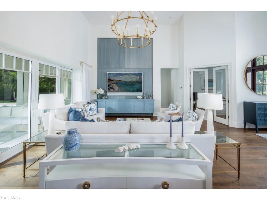 4042 Old Trail Way Naples, FL 34103 - Photo 3 of 20 a living room with furniture and a fireplace