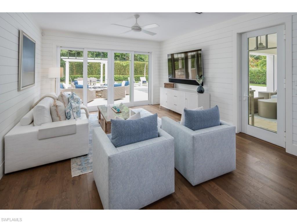4042 Old Trail Way Naples, FL 34103 - Photo 7 of 20 a living room with furniture and a flat screen tv