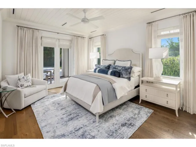 a bedroom with a large bed and a couch