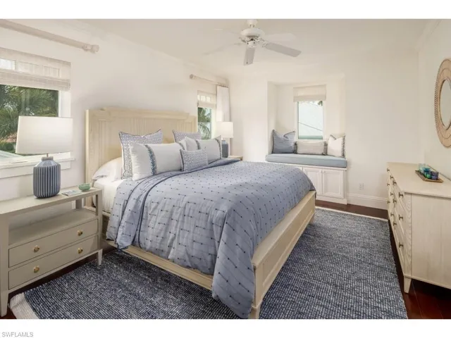 a bedroom with a bed and a lamp