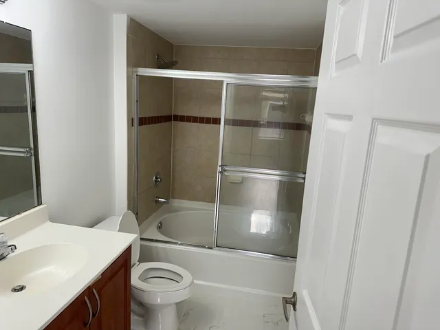 a bathroom with a bathtub and a sink