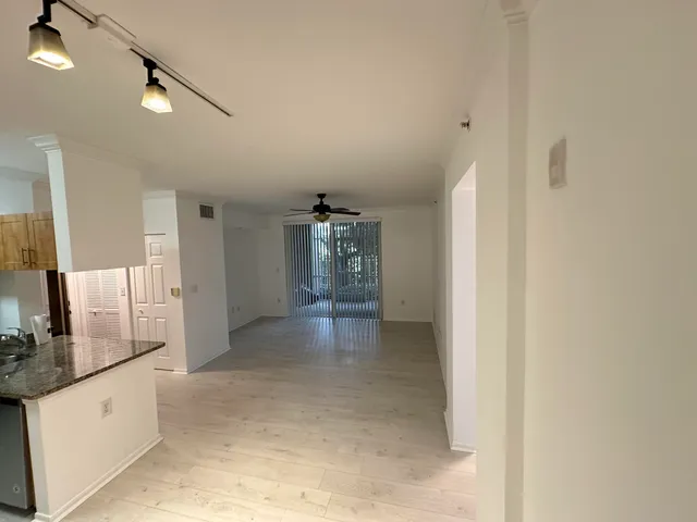 a kitchen with stainless steel appliances granite countertop a refrigerator and a stove