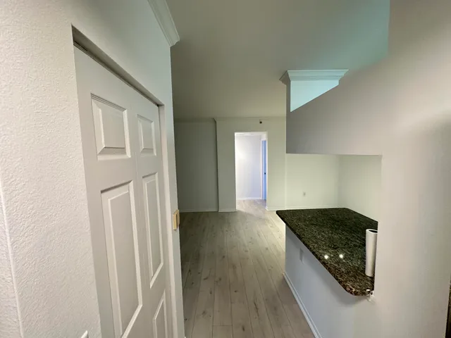 a view of a hallway with a closet