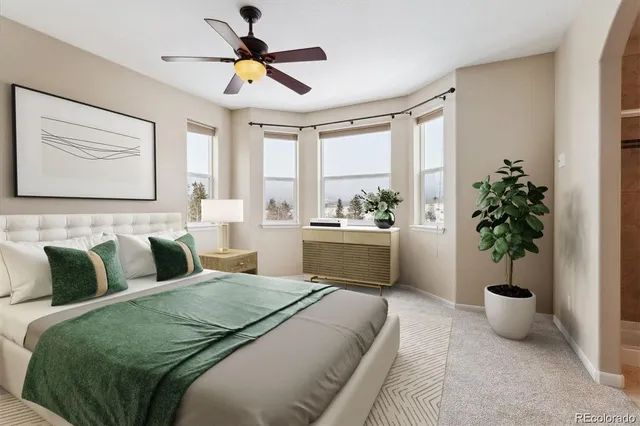 a view of empty room with ceiling fan