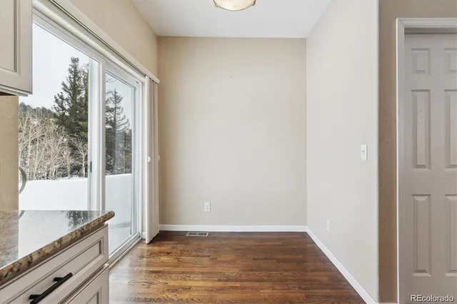 a workspace with furniture and a window