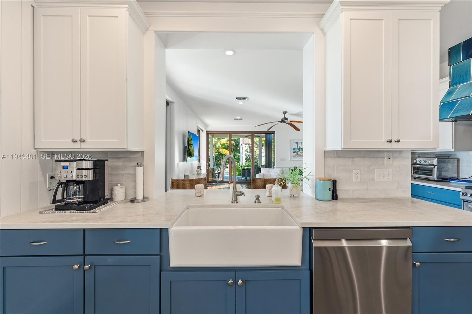 1890 Northwest River Trail Stuart, FL 34994 - Photo 18 of 52 a kitchen with stainless steel appliances granite countertop a sink a stove and white cabinets