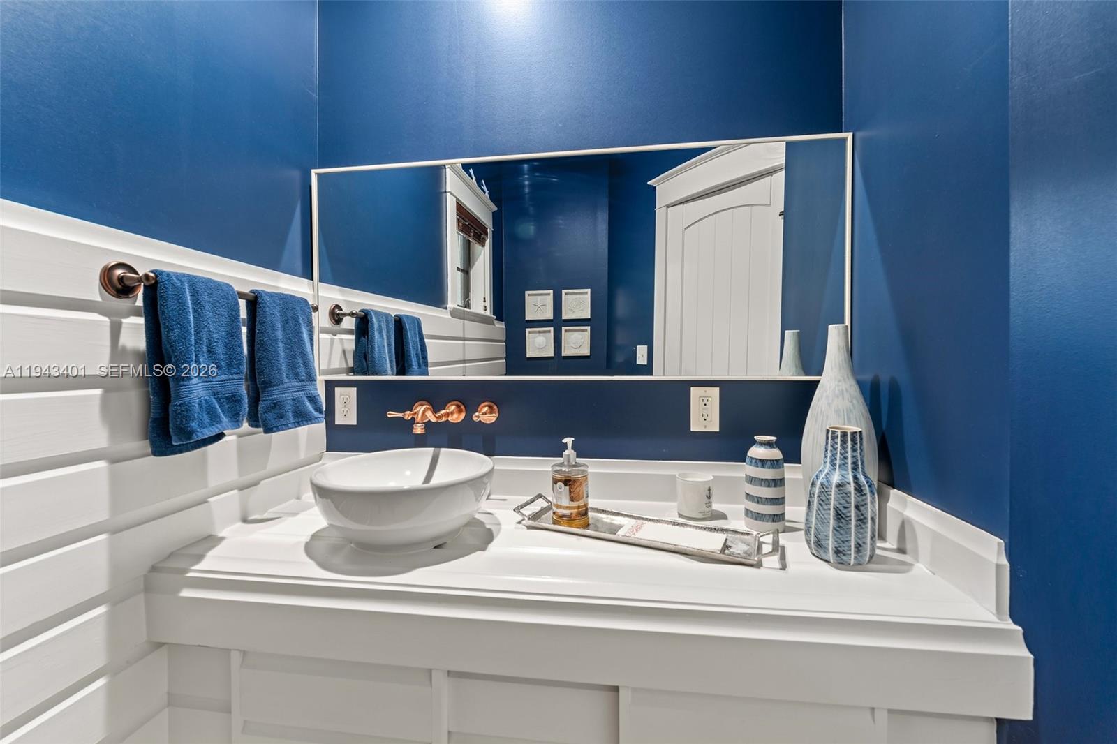 1890 Northwest River Trail Stuart, FL 34994 - Photo 21 of 52 a bathroom with a sink and a mirror