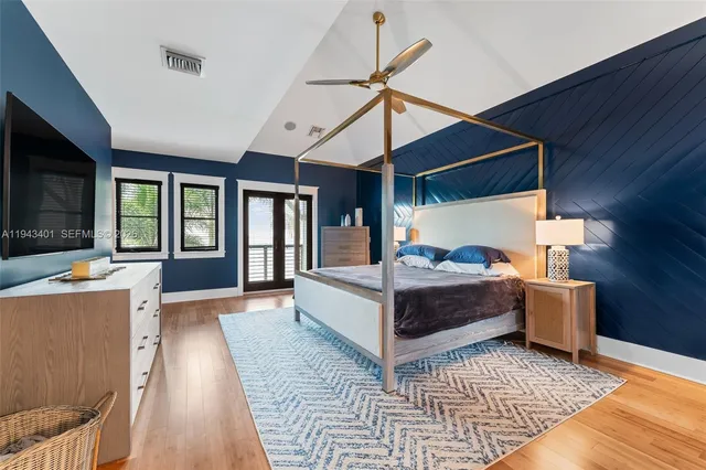 a view of a balcony with wooden floor and fence