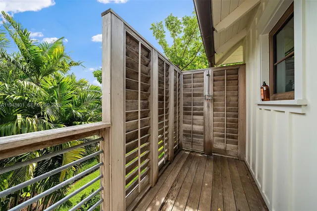 a bedroom with a bed window and couch