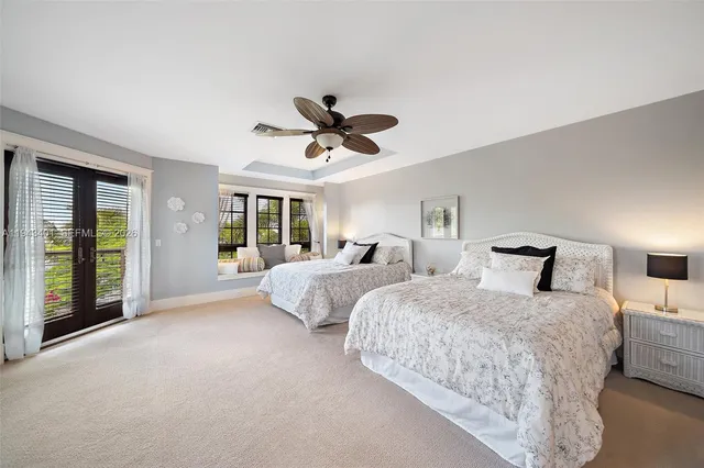 a living room with furniture kitchen view and a window