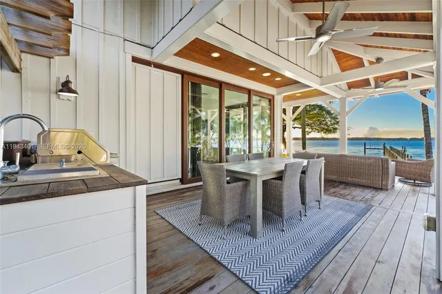 a outdoor space with patio lots of furniture and wooden floor