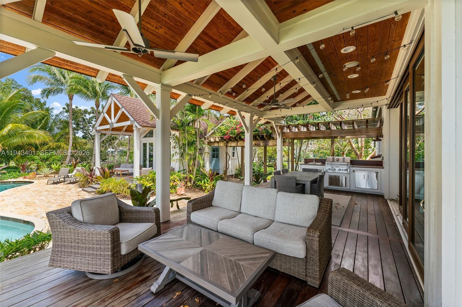 1890 Northwest River Trail Stuart, FL 34994 - Photo 34 of 52 a outdoor space with patio lots of furniture and wooden floor