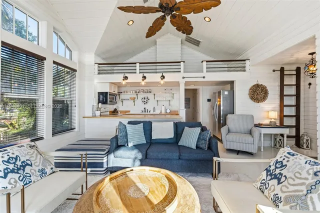 a kitchen with a stove a sink and a refrigerator