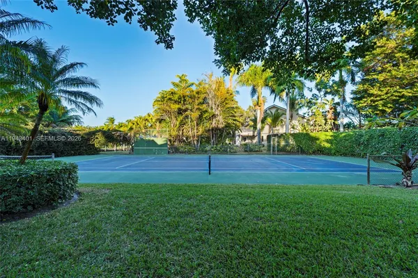 a view of a golf course with a house