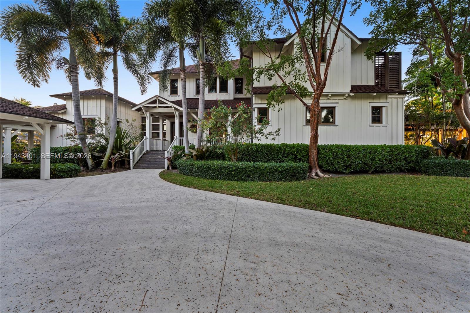 1890 Northwest River Trail Stuart, FL 34994 - Photo 49 of 52 a view of a white house with a big yard and palm trees