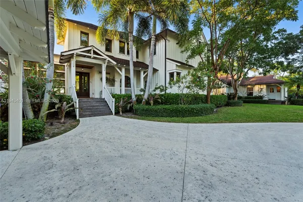 a view of a park with large trees
