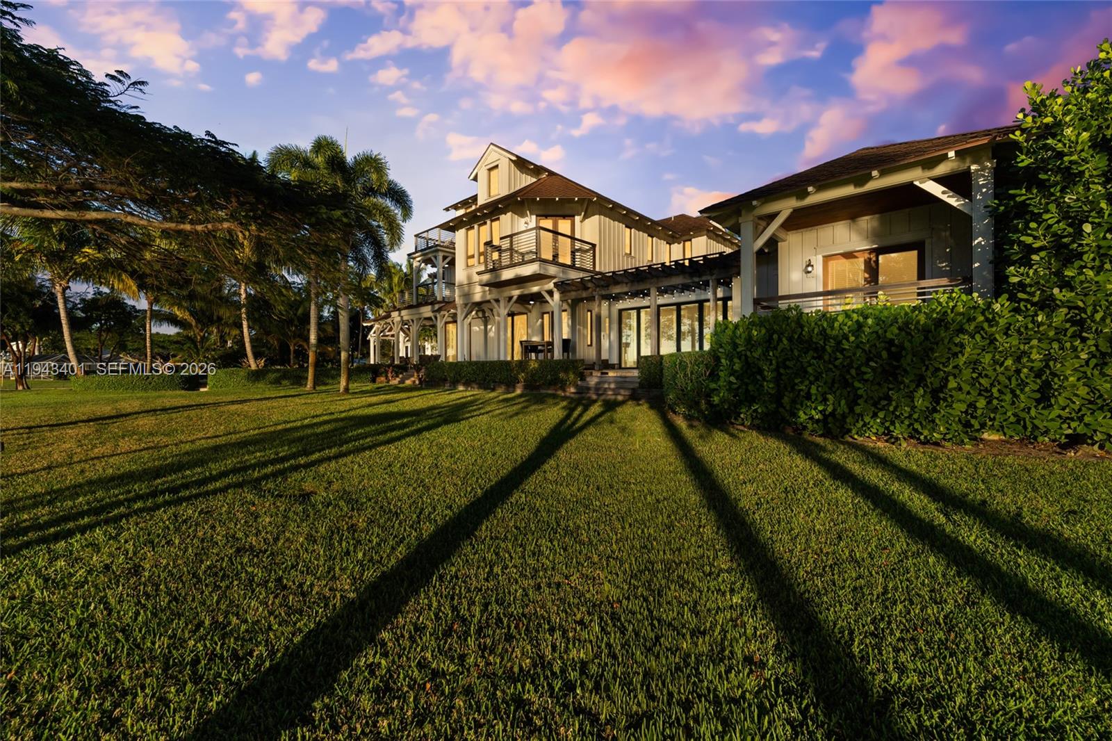 1890 Northwest River Trail Stuart, FL 34994 - Photo 8 of 52 a view of a big house with a big yard and potted plants