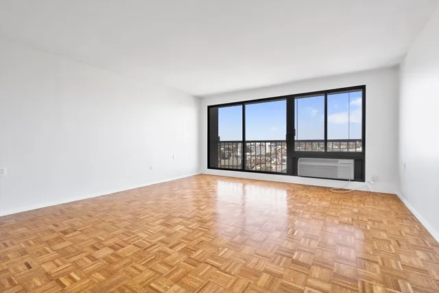 a view of kitchen with wooden cabinets