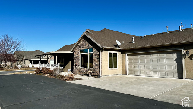 929 West 1920 South, Unit A Syracuse, UT 84075 - Photo 2 of 26 View of front of house featuring a garage