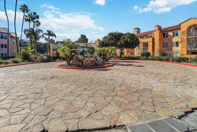 a view of a street with a building in the background