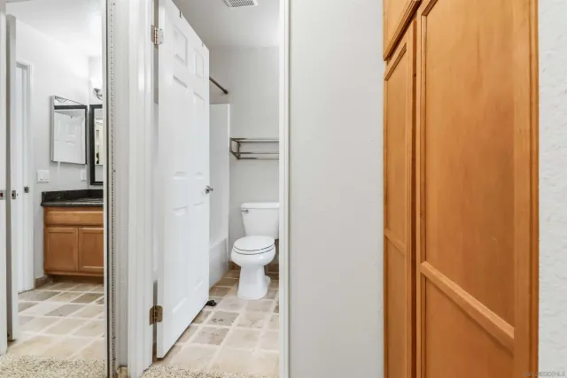 a bathroom with a toilet and a sink