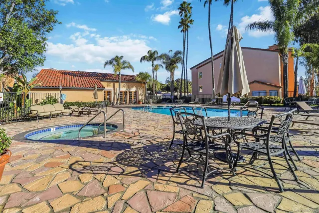 a view of a patio with swimming pool