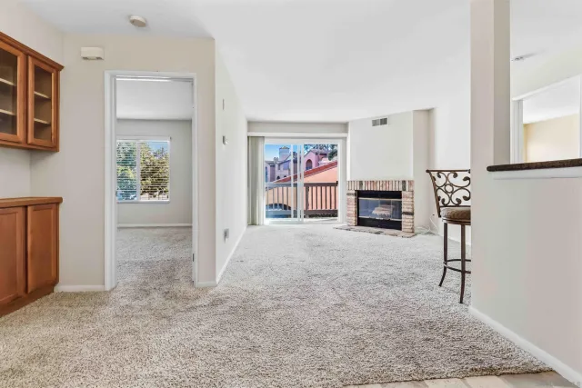 a view of a livingroom with furniture and window