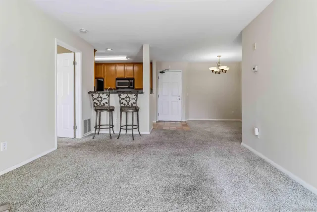 a view of a room with a flat screen tv