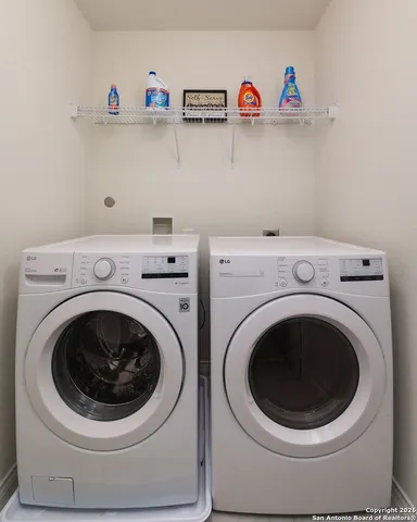 a utility room with dryer and washer