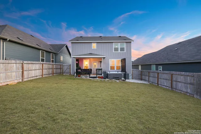 a view of a house with a garden and yard
