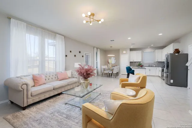 a living room with furniture and a large window