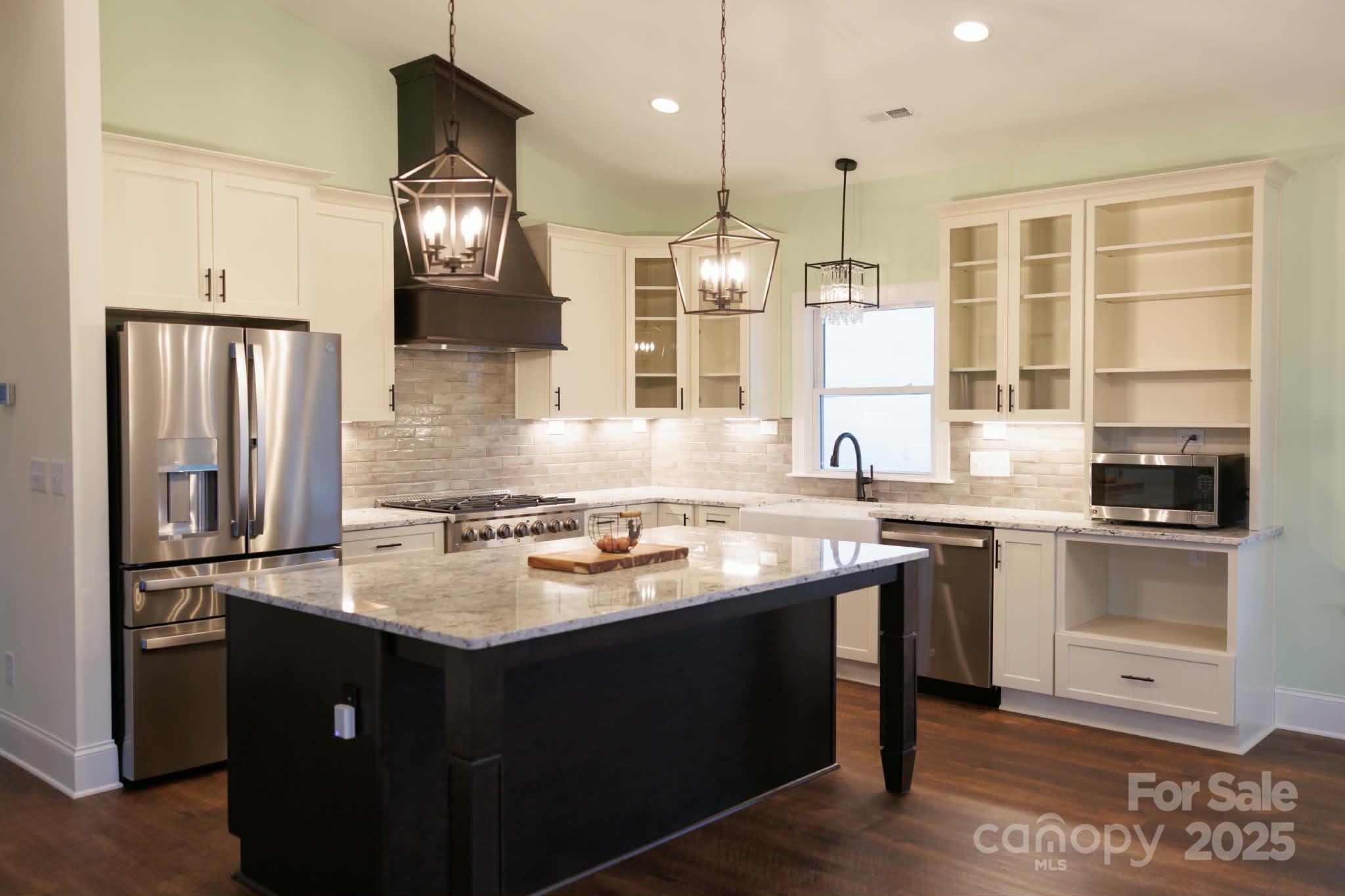 222 Guy Warlick Road Lawndale, NC 28090 - Photo 5 of 14 a kitchen with stainless steel appliances granite countertop a sink stove and refrigerator