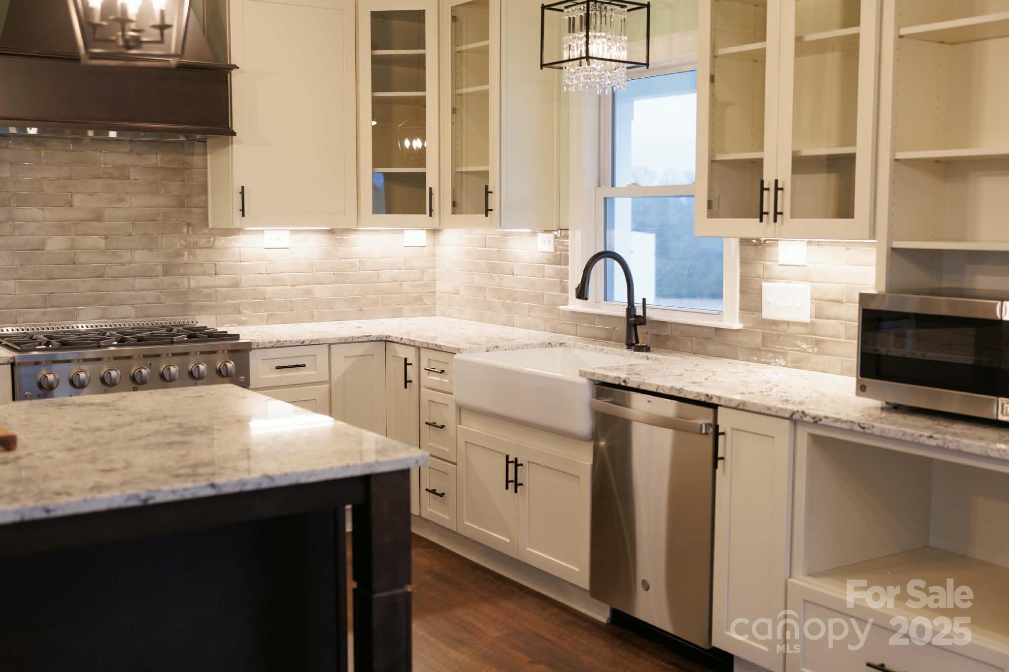 222 Guy Warlick Road Lawndale, NC 28090 - Photo 7 of 14 a kitchen with stainless steel appliances granite countertop a sink stove and cabinets